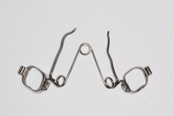 Tri-helix expander tool for dentistry.