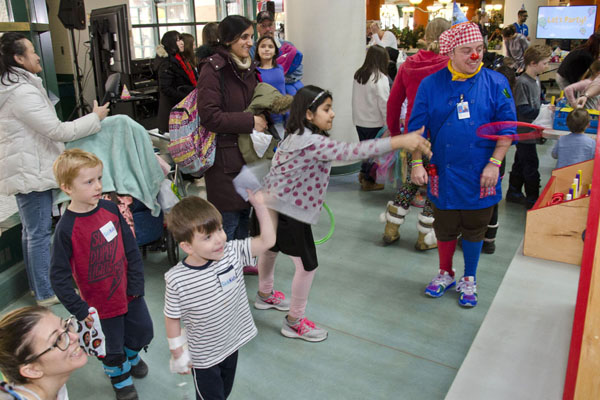Children play ring toss.