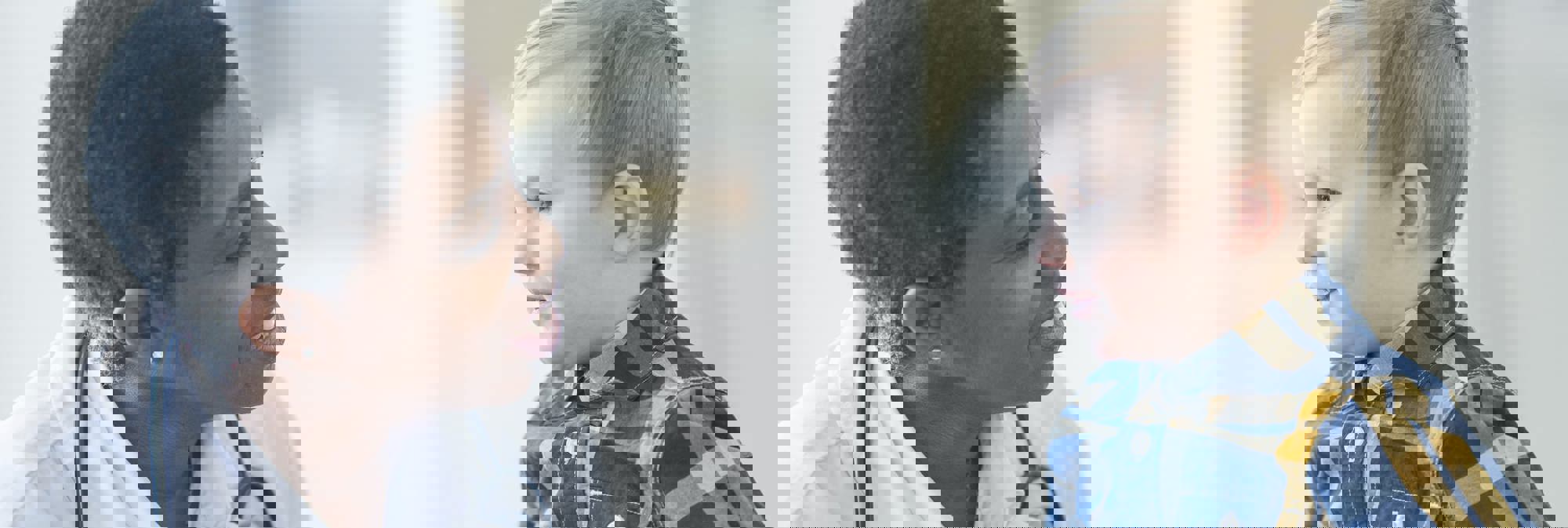 profile view of doctor and young patient looking at each other
