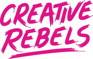 Bright pink brush-style text that reads ‘Creative Rebels’ on a white background, with a bold underline beneath the words.