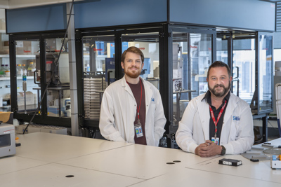 Technician Jonathan Sayewich and Facility Manager Chris Fladd in the SPARC Drug Discovery Facility at SickKids.