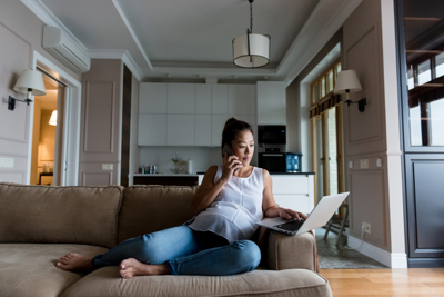 Pregnant woman talks on the phone.