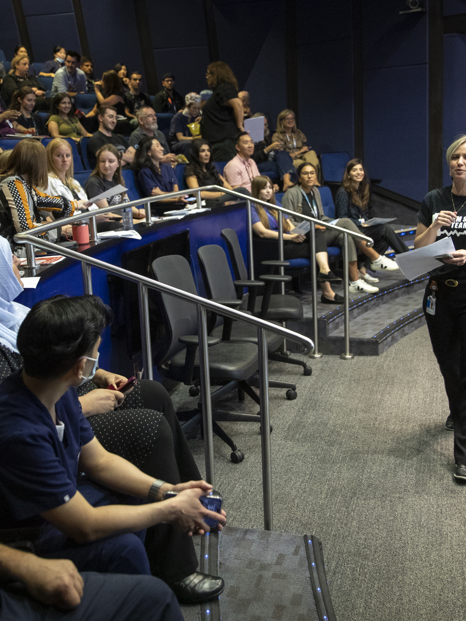 Interprofessional Education Specialist and nurse Seona Dunbar addresses a crowd of participants and facilitators