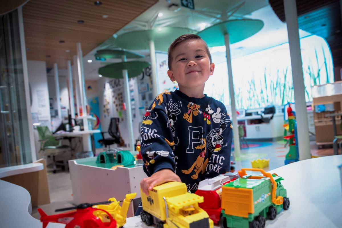 Jayden playing with trucks in the WAV PlayPark