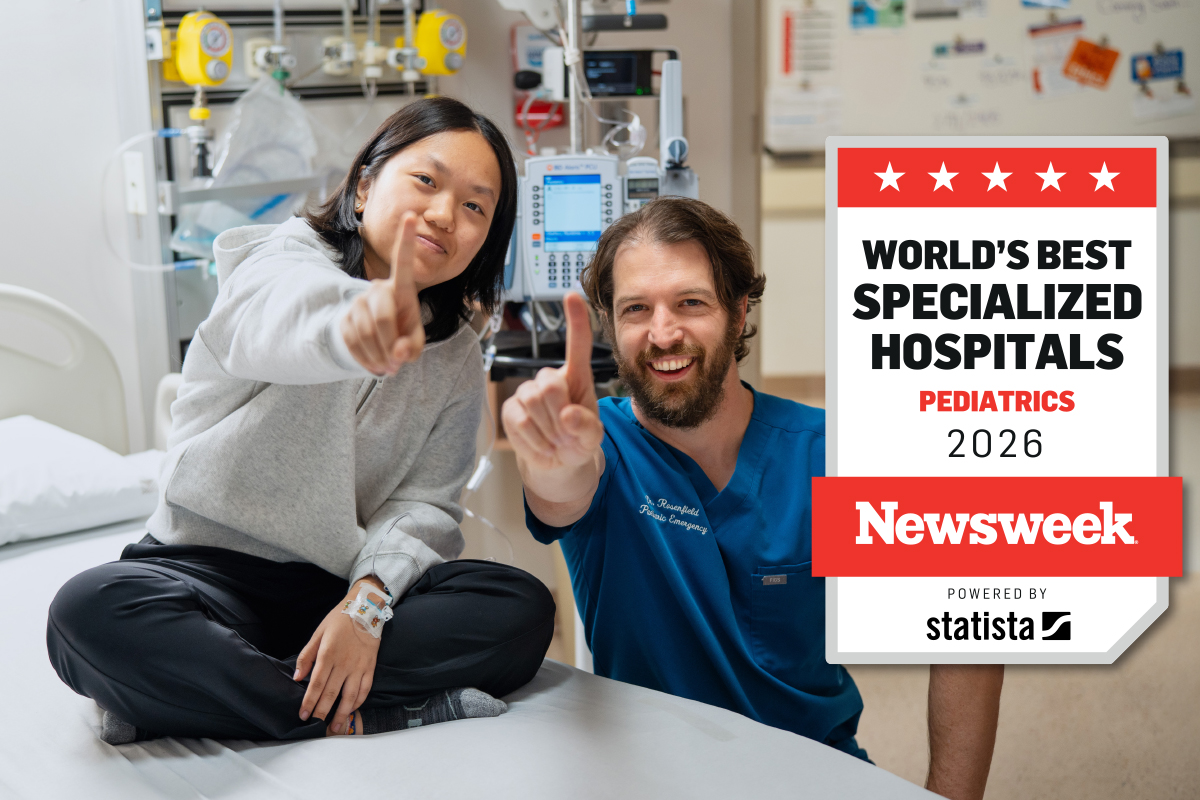 Youth and doctor giving thumbs up with a logo stating top paediatric hospital laid over the image.