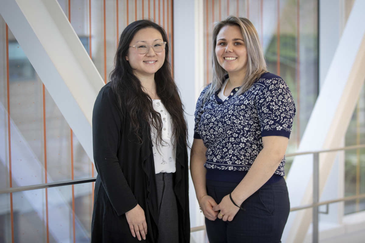 lucy chen and carly dunn both standing beside one another 